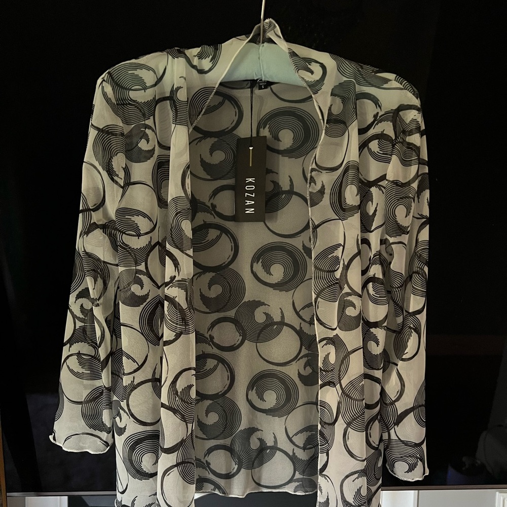 Brand new and white geometric mesh cardigan like blouse in size small.